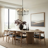 Thayer 6 Light Chandelier 24" Antique Iron in a Contemporary Dining Room with a wooden table and chairs.
