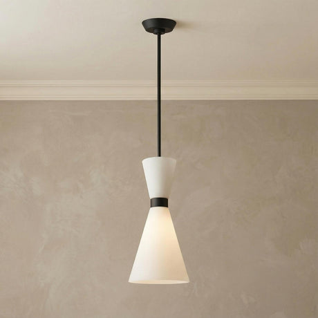 Issa Pendant 8", Matte Black geometric hourglass pendant in a Modern Entryway with textured plaster walls.
