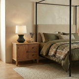 Laken Table Lamp 26", Textured Black geometric Table Lamp in a Transitional Bedroom with an olive canopy bed and wooden nightstand.