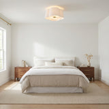 Odelia Flush Mount 14", White Fabric and Brass scalloped flush mount in a Modern Bedroom with warm wood nightstands.