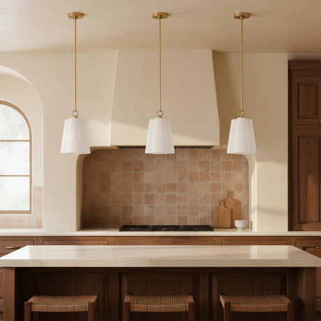 Odelia Small Pendant 9, White and Brass - Three pendant lights hanging above a kitchen island