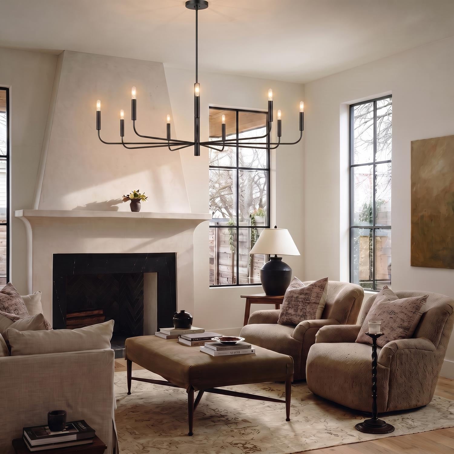 A modern farmhouse living room with an antique iron Thayer 9 Light Chandelier 48