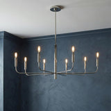 Thayer 8-Light Chandelier, Polished Nickel geometric chandelier in a Contemporary Dining Room with textured blue walls.