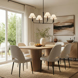 Matte Black geometric chandelier in a Transitional Dining Room with a fluted wood dining table and jute rug.