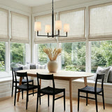 Andrew 4 Light Chandelier 27", Aged Iron linear chandelier in a Modern Dining Room with a light wood table.