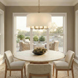 Andrew 6 Light Pendant 25", Modern Brass geometric pendant in a Transitional Dining Room with a round marble table and woven rug.