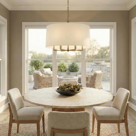 Andrew 6 Light Pendant 25", Modern Brass geometric pendant in a Transitional Dining Room with a round marble table and woven rug.