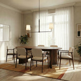 Andrew Linear Pendant 50", Aged Iron linear Pendant in a Mid-Century Dining Room with a walnut oval table and cream chairs.