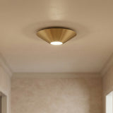 Belvin LED Flush Mount 12", Modern Brass in a Modern entryway with textured walls.