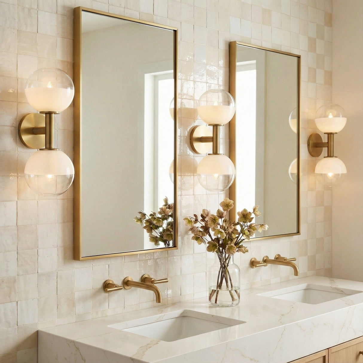 Merrick 2 Light Wall Sconce 15", Modern Brass in a Modern Bathroom with tiled walls and marble countertops.