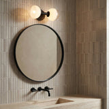 Merrick 2 Light Wall Sconce 15", Aged Iron styled in a contemporary bathroom with stacked tile.