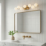 Veya 7 Light Wall Sconce 32", Modern Brass and Milk Glass styled in a Modern Bathroom with white ribbed tile.