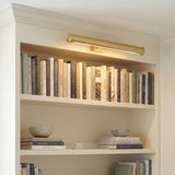 Keaton Picture Light 24, Modern Brass in a Modern living room with built-in bookshelves.