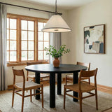 Gael Medium Pendant 22", Aged Iron white geometric pendant in a Transitional Dining Room with a black round table and woven chairs.