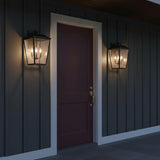 Harrison Outdoor Extra Large Wall Light 19", Old Bronze - Two outdoor wall lights flank a dark red door