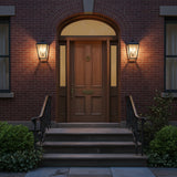 Harrison Outdoor Medium Wall Light 14, Textured Black - Front stoop on a classic brick row home flanked by two 14" tall outdoor sconces.