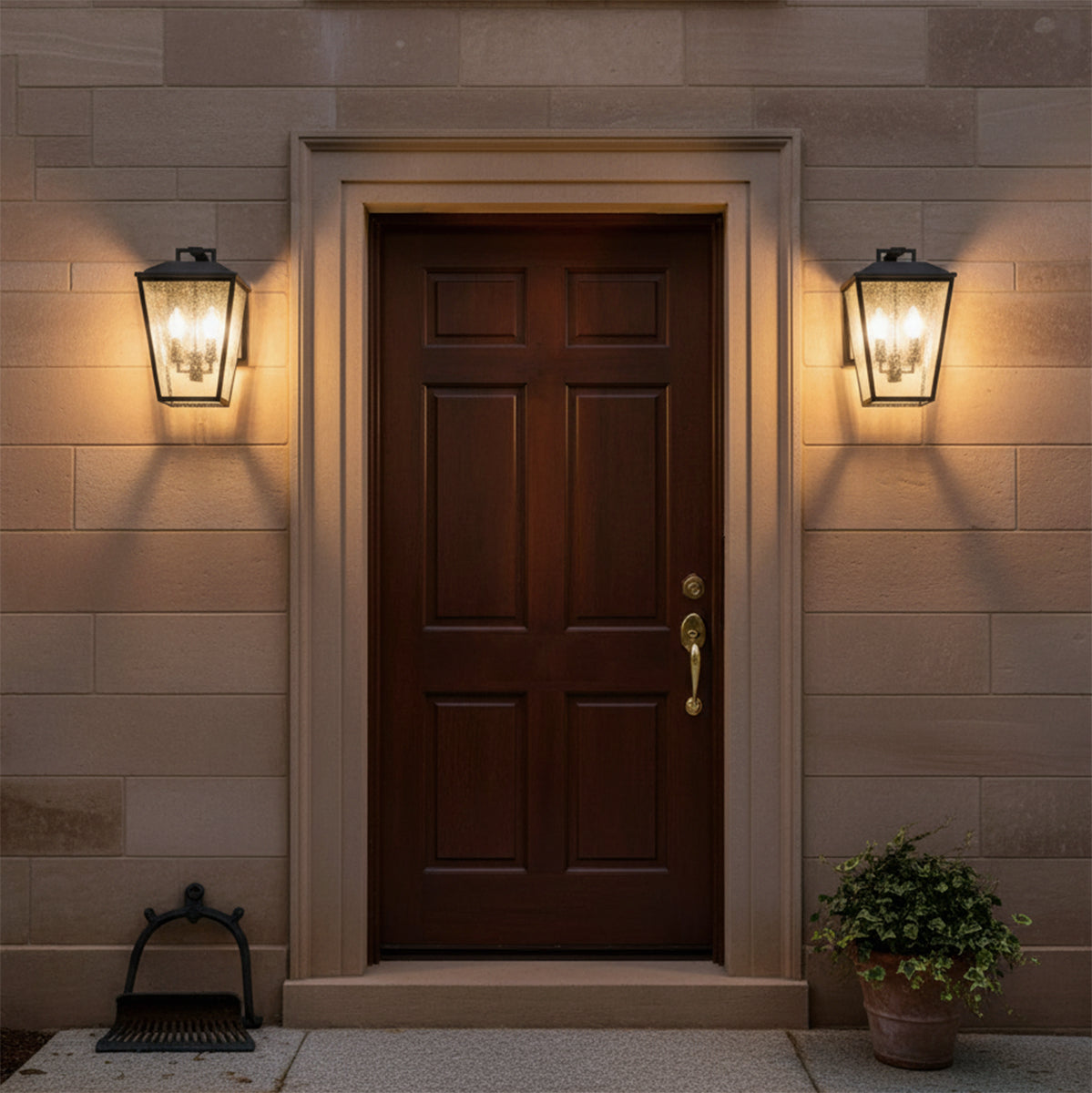 Harrison Outdoor Medium Wall Light 14", Textured Black - Front door flanked by two textured black outdoor wall lights.