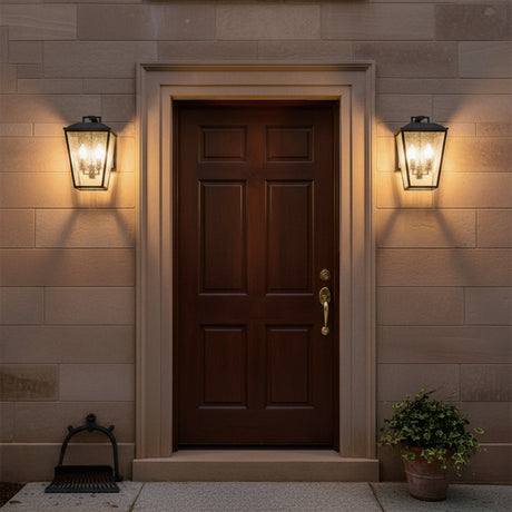 Harrison Outdoor Medium Wall Light 14", Textured Black - Front door flanked by two textured black outdoor wall lights.