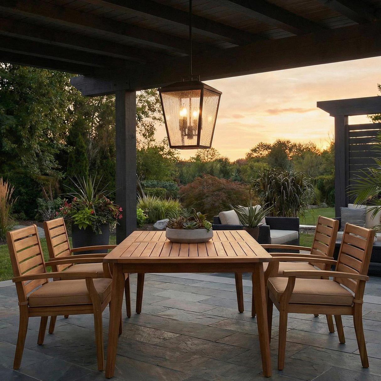 Harrison Outdoor Hanging Light, Textured Black geometric Outdoor Hanging in a Modern Farmhouse Outdoor with a teak dining set.