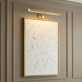 Denton Picture Light 24, Modern Brass in a Contemporary Living Room with paneled walls and a framed textured artwork.