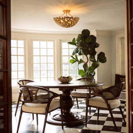 A transitional dining room features the Floren Semi-Flush 16", Aged Gilded Brass mounted over a dark wood pedestal table and black and white checkerboard marble floors.