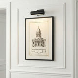 Gunther Picture Light 10", Matte Black linear picture light in a Transitional Entryway with architectural artwork and wainscoting.