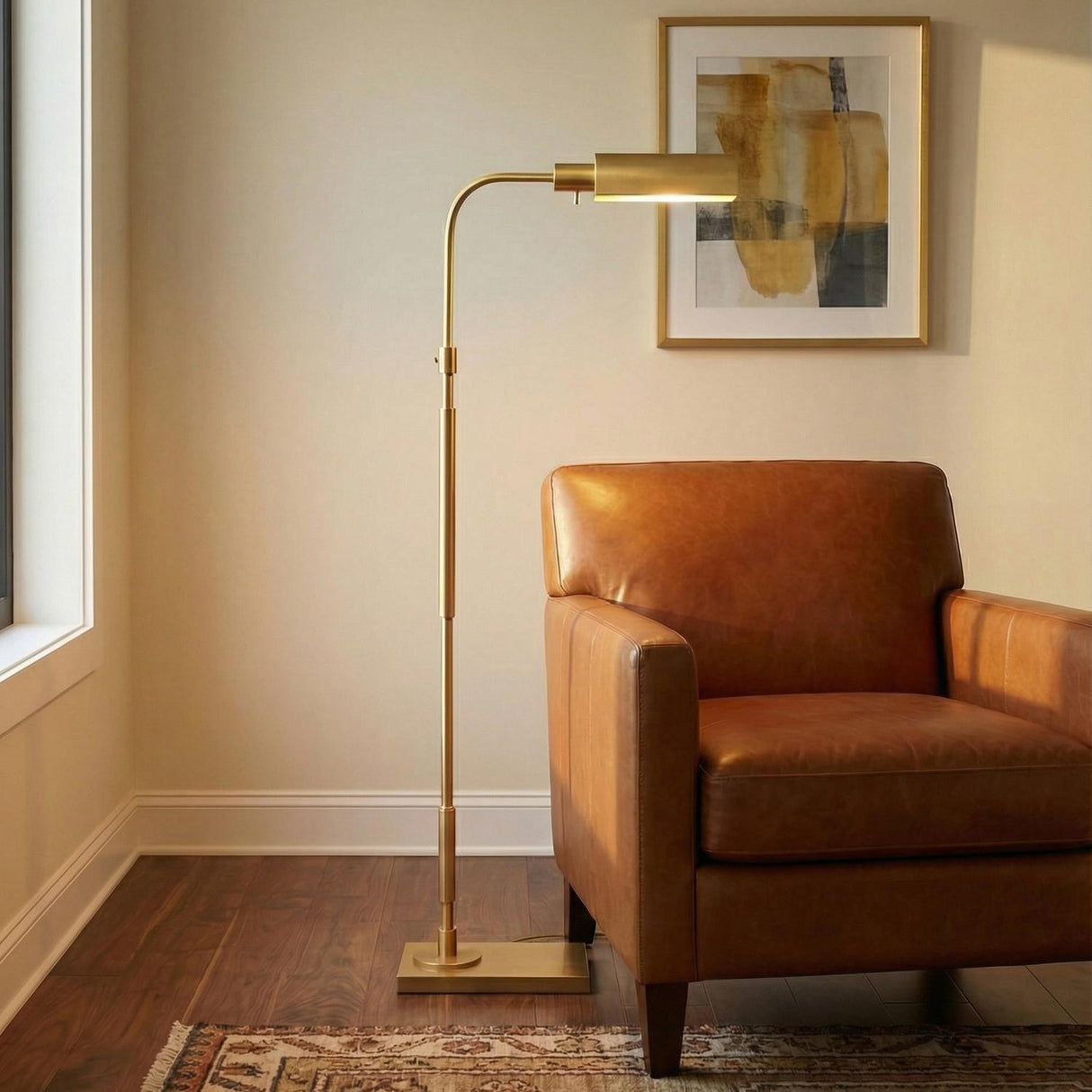 Gunther Floor Lamp, Modern Brass linear Floor Lamp in a Transitional Living Room with a brown leather armchair and patterned rug.