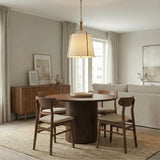 Isleton Medium Pendant 18", Aged Gilded Brass geometric Pendant in a Contemporary Dining Room with a fluted wood dining table.