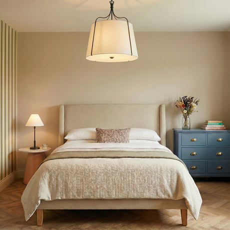Isleton Large Pendant 24", Aged Steel geometric pendant in a Transitional Bedroom with a beige upholstered bed and blue dresser, the Hazelton Table Lamp is on the bedside table