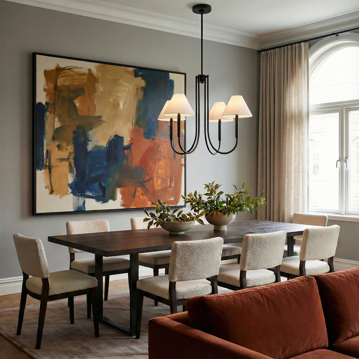 Hazelton 4 Light Chandelier 30", Matte Black geometric chandelier in a Transitional Dining Room with a dark wood dining table and abstract art.