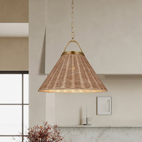 Paloma 22" Pendant light, Modern Brass and Rattan, hung in a kitchen with micro-cement range hood and autumn flowers.