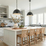 Arlen Pendant 15", Aged Iron globe pendant in a Modern Farmhouse Kitchen with a white marble island and woven bar stools.