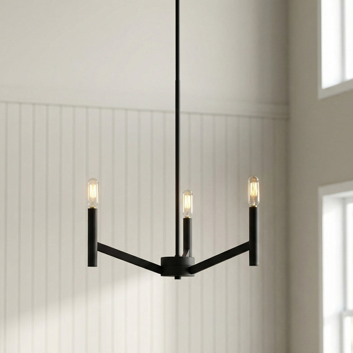 Foster 3 Light Pendant 18", Matte Black geometric Pendant in a Transitional Living Room with white shiplap walls.