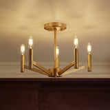 Satin Brass geometric semi-flush mount in a Transitional Dining Room with dark wood wainscoting.