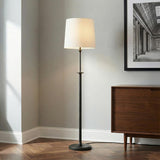 Emerson Floor Lamp, Aged Iron linear Floor Lamp in a Transitional Living Room with a dark wood console.