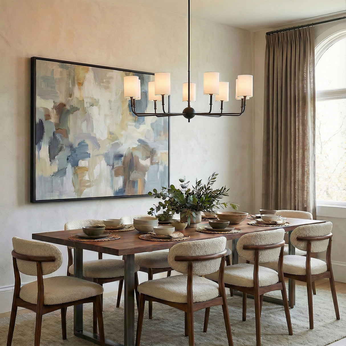 Matte Black geometric chandelier in a Transitional Dining Room with dark wood dining table and cream chairs.
