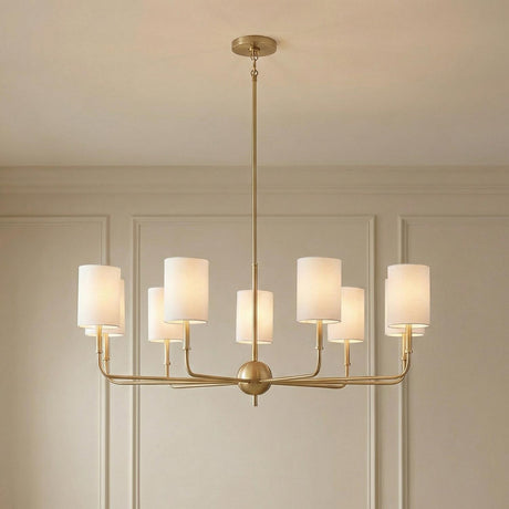 Remington 8 Light Chandelier, Satin Brass linear Chandelier in a Transitional Dining Room with picture frame molding walls.