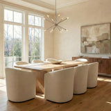 Sputnik Polished Nickel geometric Chandelier in a Contemporary Dining Room with white tub chairs and a light oak table.
