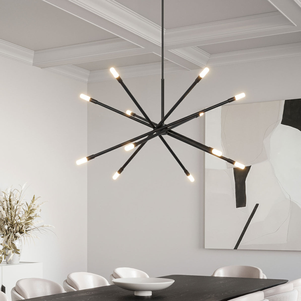 Ferris Extra Large Chandelier 42", in Matte Black, hanging in a contemporary dining room with a table and chairs.