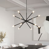 Ferris Extra Large Chandelier 42", in Matte Black, hanging in a contemporary dining room with a table and chairs.