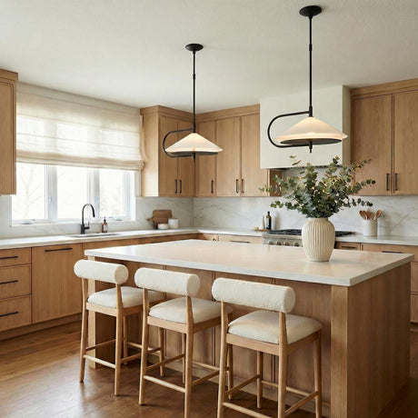 Astrid Pendant 20", Matte Black and Milk Glass geometric pendant in a Contemporary Kitchen with a white marble island and boucle stools.