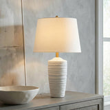 Joyce Table Lamp, Textured White linear Table Lamp in a Transitional Living Room with a grey wood console table and abstract art.