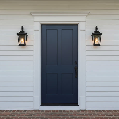 Pembroke Extra Small Outdoor Wall Light 14, Textured Black - Two black lanterns flank a navy blue door