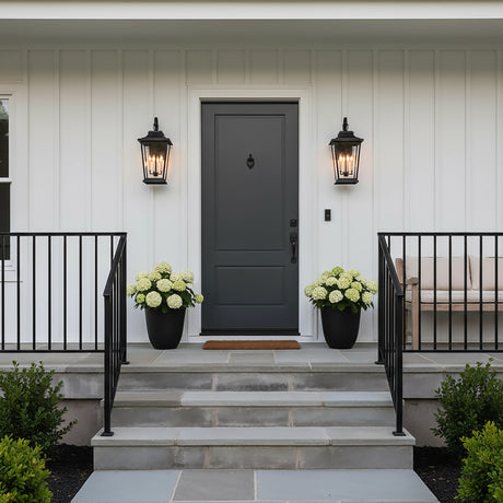 Pembroke Large Outdoor Wall Light 26", Textured Black - Black outdoor wall lights flanking a dark gray door.
