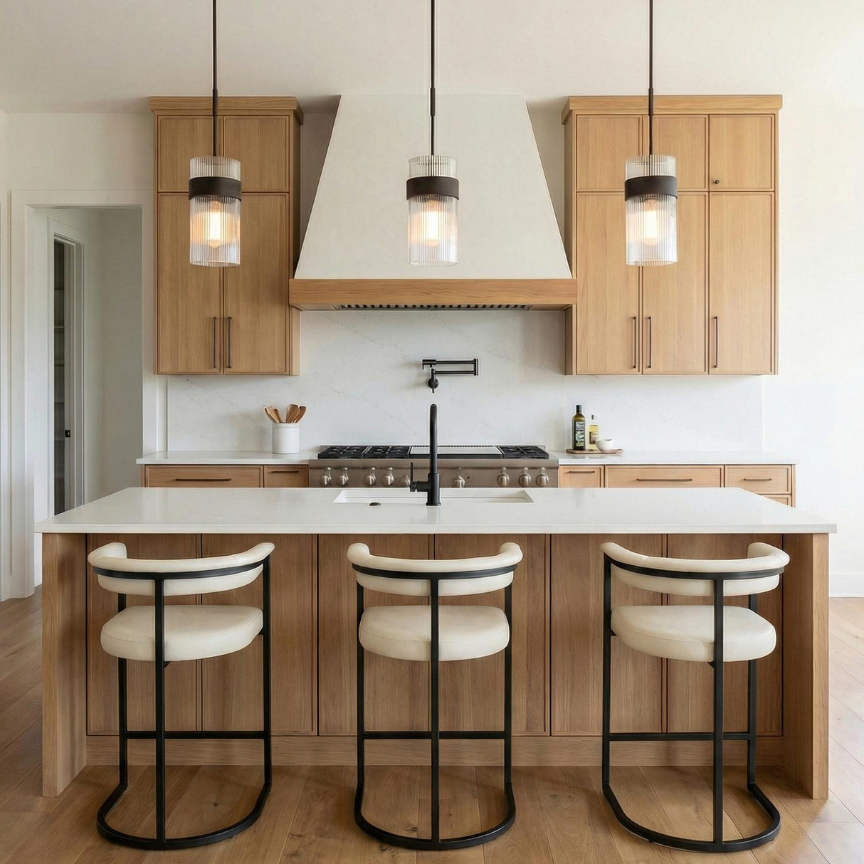 Barclay Medium Pendant 7", Aged Iron geometric pendant in a Modern Farmhouse Kitchen with a white marble island and light wood cabinets.