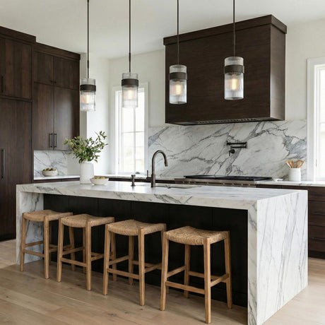 Barclay Medium Pendant 7", Aged Iron ribbed glass Pendant in a Modern Farmhouse Kitchen with a white marble island and woven stools.