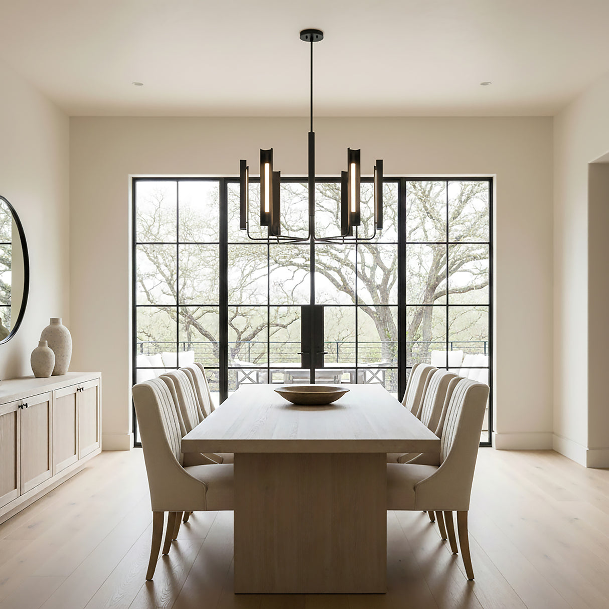 Robin 6 Light LED Chandelier 36", Matte Black styled in a Modern Dining Room with light wood floors and neutral walls.