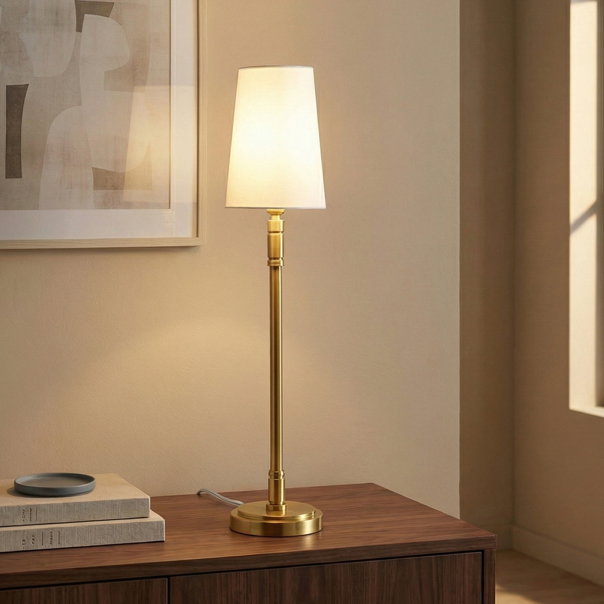 Modern Brass linear table lamp in a Transitional Living Room with a dark wood cabinet & abstract art.