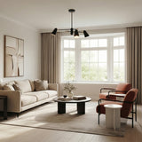 Selby Adjustable Chandelier 30" in Matte Black styled in a Modern Living Room with hardwood floors.