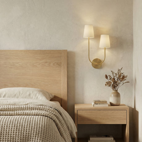 Greta Double Wall Sconce, Satin Brass (Style RIGHT) styled in a Modern Bedroom with textured walls and natural wood furniture.